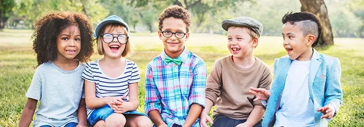 Happy kids laughing outside.
